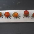 Hormigas con pepinillos y cherrys
