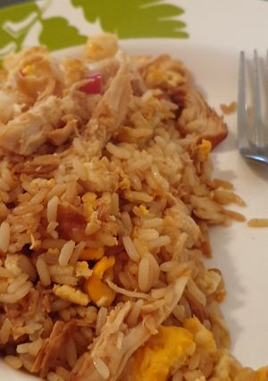 A picture of Egg fried rice... and some chicken.