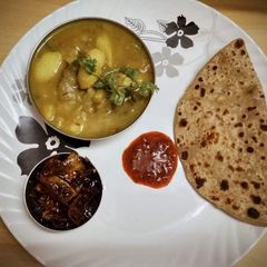 A picture of Sattu paratha with aloo bari ki sabji.