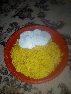 A picture of Indomie with boiled egg.