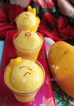 A picture of Mango Rasgulla with mango shots.