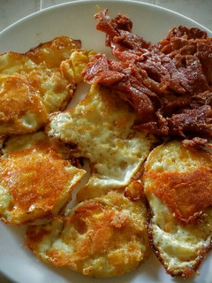 A picture of Cheese-Fried Bacon and Eggs.