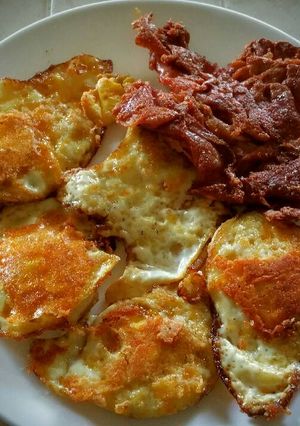 A picture of Cheese-Fried Bacon and Eggs.