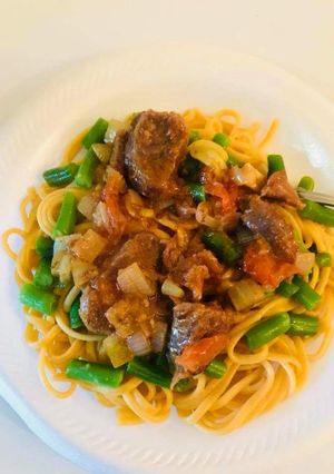 A picture of Spaghetti with beef stew.