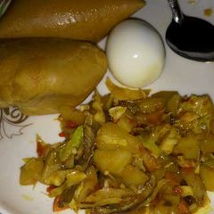 A picture of Moi moi and arish potatoes with cabbage souce.