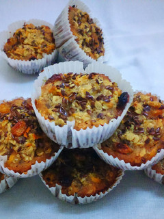 A picture of Carrot Oatmeal Muffins with flax seeds.