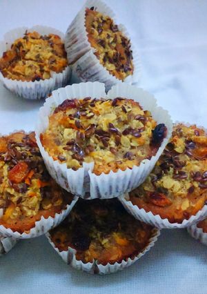 A picture of Carrot Oatmeal Muffins with flax seeds.