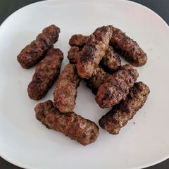 A picture of Ćevapčići (small grilled kebabs).