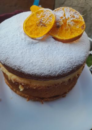 Una foto de Crema fresca de durazno, naranja y chocolate blanco