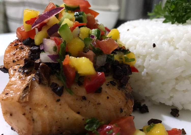 Pan-seared salmon in garlic butter sauce and mango salsa