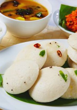 A picture of Masala idli with coconut chutney.