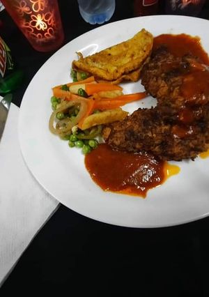 A picture of ❤🌹Fry Chicken Steak with red sauce n vegetables n egg🌹❤.