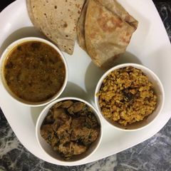 A picture of Methi with soya chunks, lauki ki sabji, dry urad dal platter.