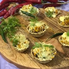 Jhunka Bhakri Cheesy Tarts (Maharashtrian Street Food) A picture of Jhunka Bhakri Cheesy Tarts (Maharashtrian Street Food).
