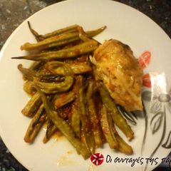A picture of Chicken with okra in the oven.