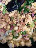 Tortellini asciutti con verza e speck