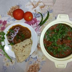 A picture of Tomato Mutton Curry.