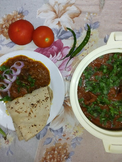 A picture of Tomato Mutton Curry.