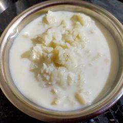Milk & Poha A picture of Milk & Poha.