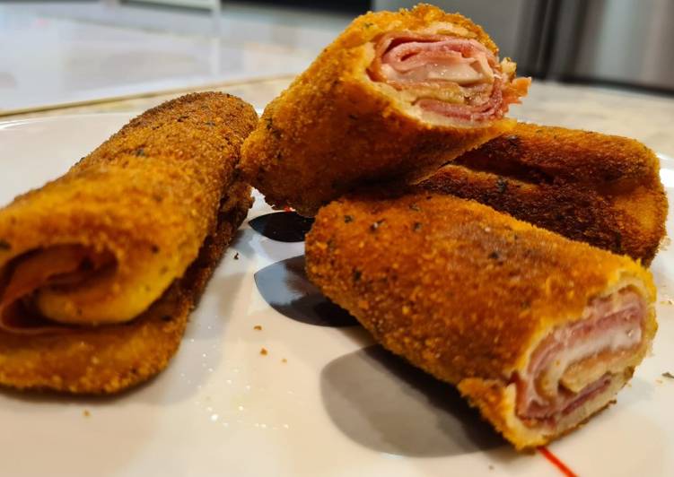 Rollitos de pan de molde con dos tipos de jamón y queso