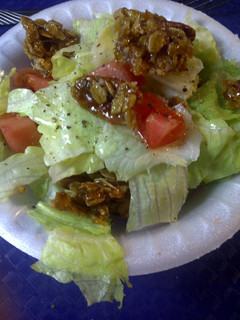 A picture of Salad with a crunch topping.