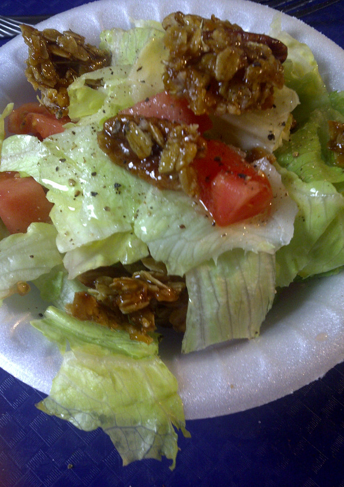 A picture of Salad with  a crunch topping.