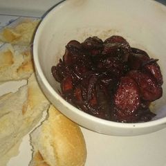 A picture of Chorizo Cooked in Red Wine.