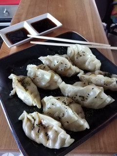 Una foto de Gyozas de cerdo al vapor