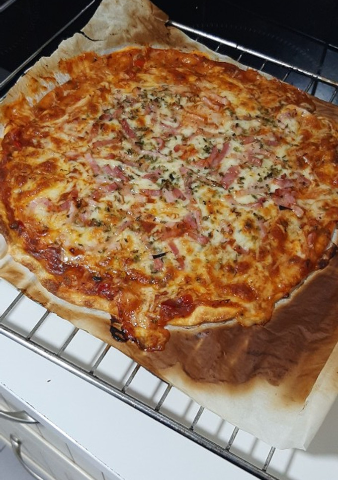 Una foto de Pizza de queso y bacon