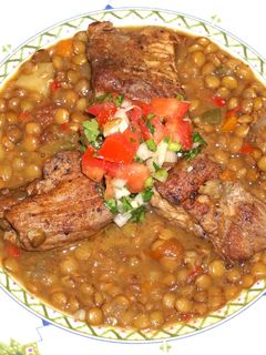 A picture of Cajun pork spare ribs and lentils.