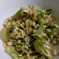 A picture of Brussel sprout, ginger, grapes walnut salad.