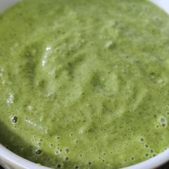 A picture of Green grapes and raw mango chutney.