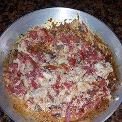 A picture of Scrambled Eggs with Brown Flour Chapatis.