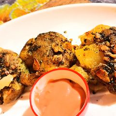 A picture of Chilli garlic smash baked potato.
