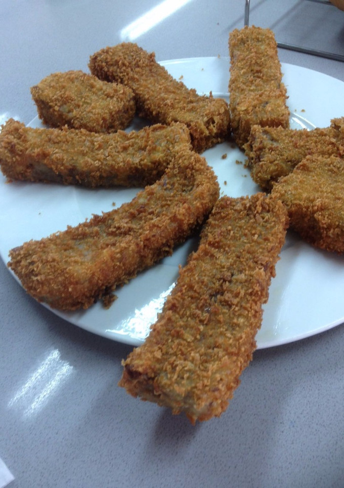 Una foto de Manitas de cerdo rebozadas con pan rallado chino