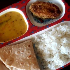 Dal, rice, with fish fry and roti A picture of Dal, rice, with fish fry and roti.