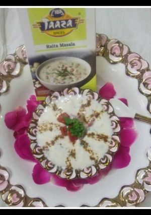 A picture of Smoked onion and tomato raita with ciba raita masala.