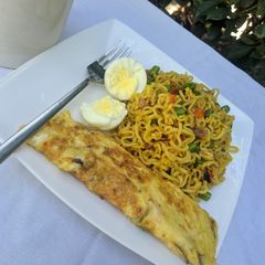 Stir fry noodles with egg omelette and boiled egg A picture of Stir fry noodles with egg omelette and boiled egg.