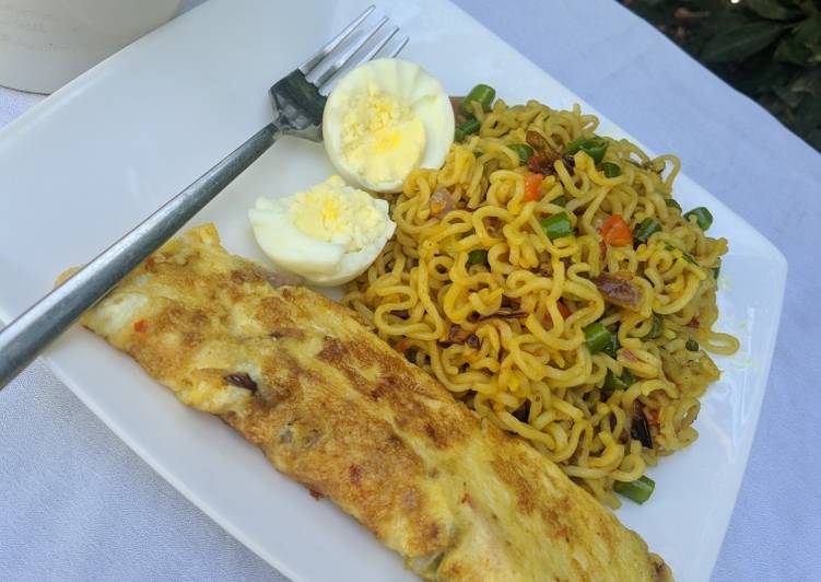 Stir fry noodles with egg omelette and boiled egg