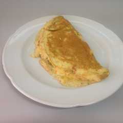 Una foto de Omelette con choclo y queso