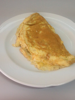 Una foto de Omelette con choclo y queso