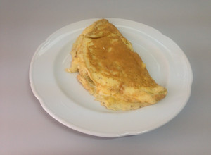 Una foto de Omelette con choclo y queso