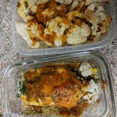 A picture of Baked cauliflower tilapia over quinoa with tomato curry sauce.