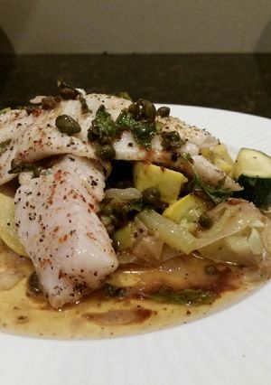 A picture of Brad's keto friendly walleye w/ basil caper browned butter sauce.