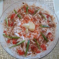 A picture of Aloo phulki chaat with red chilli.
