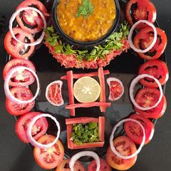 A picture of Panratna dal with salad.