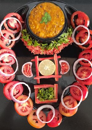 A picture of Panratna dal with salad.