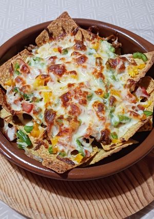 A picture of Nachos with Meat and Peppers.
