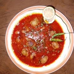 A picture of Less spice Peas & potato koftas 🥔 with red gravy.