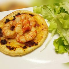 A picture of Sun-dried tomato and prawn tartlet.